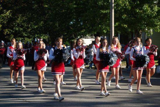 Emily Huddleston marches with the South Middle School cheerleaders in the annual Maple Leaf Parade in Carthage, Missouri, in October of 2011, five months after the tornado. The spring following the tornado, she also went out for track. On the tornado's one-year anniversary, Emily ran in the Joplin Memorial Run 5-kilometer race and came in second for her age group for girls.