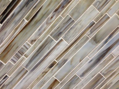 Daltile's take on milkglass with a variegated pattern also can be used as a room accent or whole wall covering. www.daltile.com