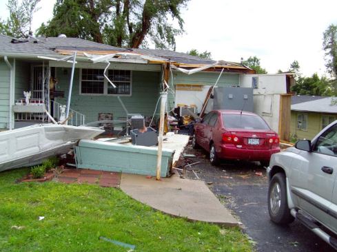 An intact Twister Safe tornado shelter at the back of a destroyed garage in a Joplin home after the tornado. Seven of Twister Safe’s units were in the path of the storm.