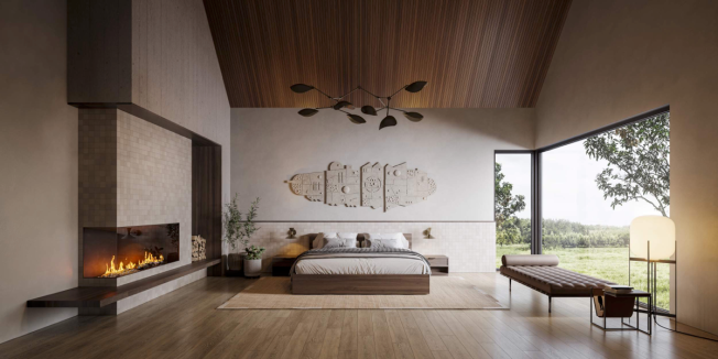 The primary suite provides a sanctuary in the east wing of the home. Its warm palette is enriched with a custom fireplace framed by a tile surround that connects to the adjacent headboard wall. A built-in walnut bench wraps around the base of the fireplace and provides a resting place to gaze across towards  the grand windows peering out into the courtyard. Overhead, the narrow wood paneled ceiling echoes the materiality of the exterior siding, further encapsulating indoor-outdoor living. Bittoni Architects accessorizes the space with a grand 101 Copenhagen pendant lamp, wood grain furnishings, and a curated nook grounded by a custom leather Barcelona daybed. 