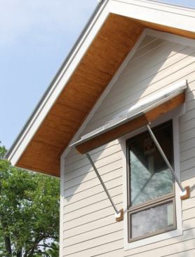 Deep roof overhangs, awnings, and porches help block direct sun exposure, which reduce heat load and&nbsp;keep the house cooler.