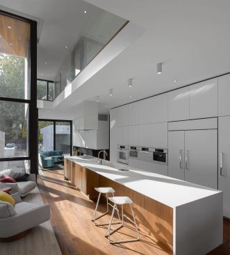 The kitchen, dining, and living areas comprise a single open space.