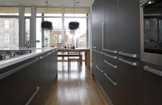 Sleek dark cabinets with modern hardware keep time with this Chicago apartment building’s glass and steel aesthetic. Project: 1615 North Wolcott, Chicago; Builder/Developer: Ranquist Development, Chicago; Architect: The Miller| Hull Partnership, Seattle