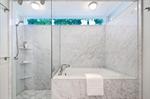 Combining two small mid-century baths yields a master bath masterpiece. 
