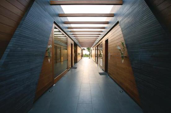 The pods are clad in recycled teak planks and local basalt, or lava rock, which adds thermal mass and helps anchor the structures during tropical storms.