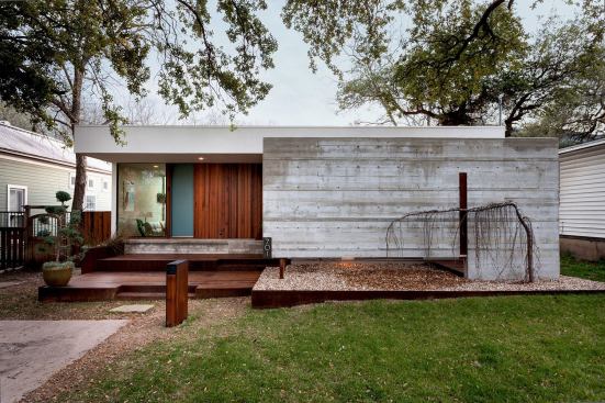 The house is on a street with other modestly-sized homes, in a neighborhood with independent stores and restaurants.