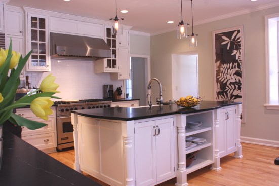 This farmhouse had received several updates and renova-
tions over the years. However, the floor plan was conflict-
ing amongst the kitchen, laundry, mudroom, and powder 
room. A complete reorganization of the first floor was 
achieved through multiple structural changes that al-
lowed for a larger kitchen and created better flow be-
tween adjacent rooms. The kitchen includes custom 
painted cabinetry, a farmhouse style sink, and soapstone 
countertops. A commercial size Viking range, hood, and 
Sub Zero refrigerator bring a theme of stainless steel to 
the kitchen which is accentuated by brushed nickel hard-
ware and island faucet. Specialty lighting, glass door 
cabinets, and a grand, eight foot island are just a few of 
the features that make this kitchen stunning.