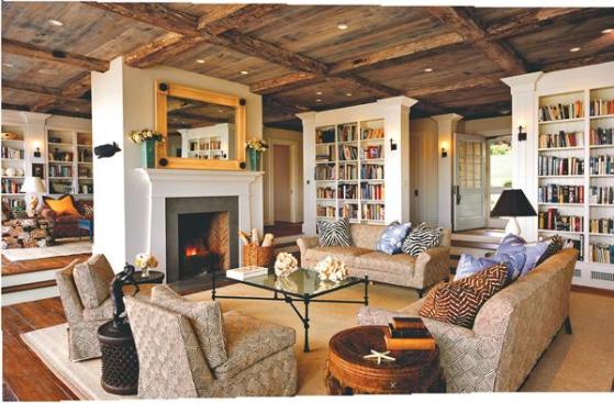 Reclaimed barn wood appears on the ceilings and floors throughout the main living space (this page) and kitchen (opposite), accentuating the house's hand-hewn feeling.