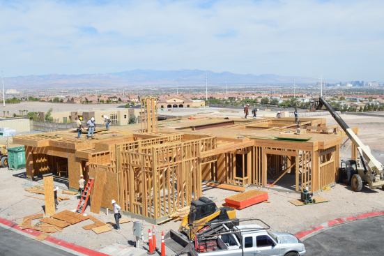 The elevator shaft takes shape above the first level.