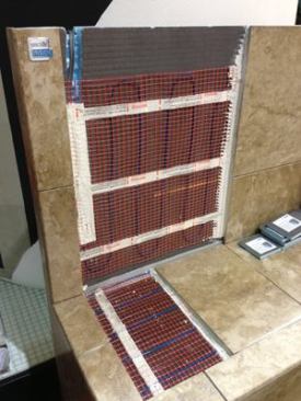 Bench Heating This British company is getting more attention in the US with its radiant heating product. Approved for a range of applications from under laminate flooring to inside the shower, such as in this shower seat, the elements are designed to heat the whole room, and not just the floor area. The sleek thermostat it works with has multiple settings to help users monitor energy use. 
WarmUp | 888.927.6333 | warmup.com