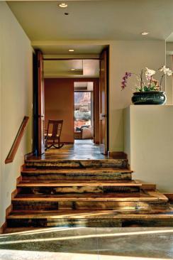 To better accommodate the multi-level site, the floor plan steps up in two areas.