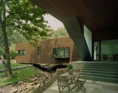 The one-story, public portion of the house spans an existing creek-a natural feature especially beloved by the owners' two children.