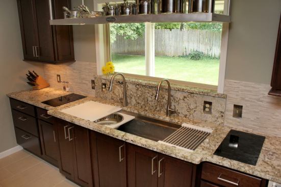 The Galley Sink system is a stainless steel sink that’s equipped with accessories, such as cutting boards, colanders, a drain rack, and stainless bowls that slide above and below each other on two tiers inside the sink to accommodate food preparation, clean up, and serving in one place. Various sizes are available. 
www.thegalleysink.com.