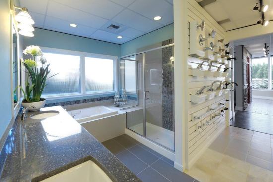 Today’s buyers want a master bath that’s a spalike retreat. Solid, linear floor tile, quartz countertop, mosaic accents, and cool color tones create a fresh and calming space. Builder: Quadrant Homes, Seattle; Design Studio: Success Strategies; Merchandiser: Cynthia Higgins Design