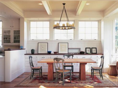 Eleven-foot ceilings allowed for high windows and a ceiling beam layout that helps organize first-floor spaces. 