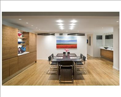 The formal dining room. Uniform flooring unites all the spaces, creating one contiguous living space.