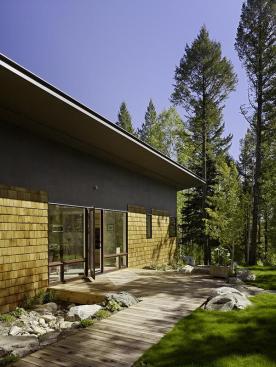 The sites many trees cast shadows that help to naturally cool the building, which has no air conditioning.