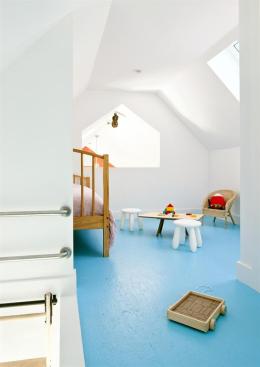 The children's sleeping and play area is accessed via ladder.