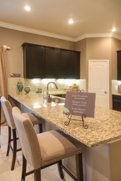 The kitchen of the builder’s Martha model opens into the living room/dining area and features no-VOC cabinets and Energy Star appliances. Energy-efficient features come standard in every Betenbough home.