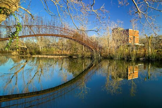2008 Outdoor Spaces' Winners
2008 Grand Award - 
Austin, Texas, Pedestrian Bridge
Entrant/Architect: Mir&oacute; Rivera Architects, Austin, Texas; 
Builder: Signor Enterprises, Austin  Built to connect the main house to the guesthouse (shown), this footbridge makes a poetic leap across an 80-foot-wide lagoon.