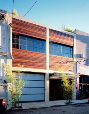 The new ipe and glass fa&ccedil;ade updates the streetscape.