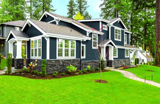 new luxury home with elegant touches including covered entrance, columns