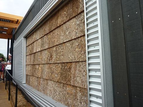 An homage to Lincoln Memorial architect Henry Bacon, who used bark siding on a group of North Carolina mountain homes in the 1890s, poplar bark shingles adorn the front fa&ccedil;ade and encase the largest outbuilding as a rustic, low-maintenance, and sustainable exterior finish.