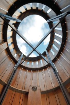 
        Once the steel frame had been lowered 
onto the porch, the team rotated it until the structural crossbars were 
in perfect alignment with the orthogonal points of a compass.