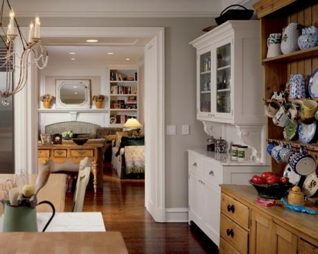 White built-in cabinets pay homage to, but don't overshadow, the homeowner's prized pine hutch