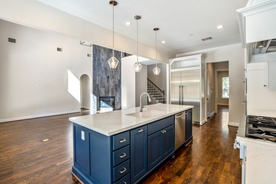Kitchen looking into open concept living room