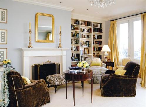 The master bedroom fireplace lends a comfortable scale to the high ceilinged space.