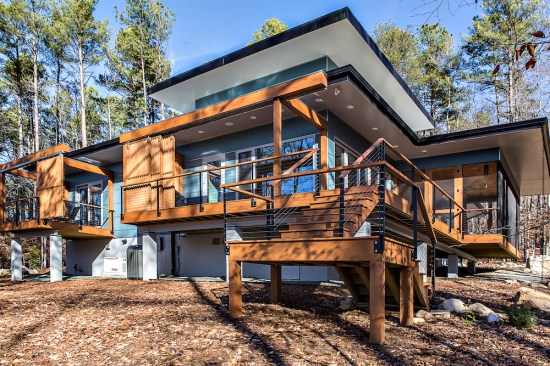 A wrap-around deck provides more outdoor living space and connects the porch to the grilling area.