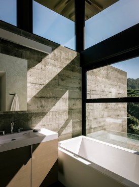 Raw materials in this bath lend to a natural, organic experience.&nbsp;Project: Butterfly House by Feldman Architecture&nbsp;