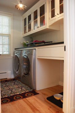 This farmhouse had received several updates and renova-
tions over the years. However, the floor plan was conflict-
ing amongst the kitchen, laundry, mudroom, and powder 
room. A complete reorganization of the first floor was 
achieved through multiple structural changes that al-
lowed for a larger kitchen and created better flow be-
tween adjacent rooms. The kitchen includes custom 
painted cabinetry, a farmhouse style sink, and soapstone 
countertops. A commercial size Viking range, hood, and 
Sub Zero refrigerator bring a theme of stainless steel to 
the kitchen which is accentuated by brushed nickel hard-
ware and island faucet. Specialty lighting, glass door 
cabinets, and a grand, eight foot island are just a few of 
the features that make this kitchen stunning.