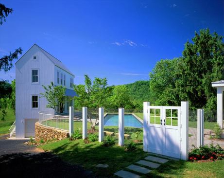 The project contains a lower level for a garage, a main floor for entertaining, and second- and third-floor bedrooms for overnight guests.