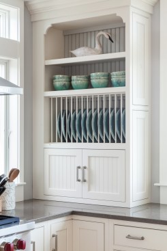 Built in shelves provide a decorative storage space and are a change from traditional cabinets.&nbsp;Project: Cape Cod Beach House by REEF&nbsp;