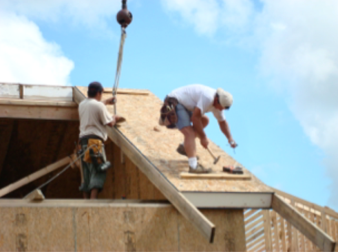 Figure 2: Carl Franklin Homes constructing roofs with crane set SIP panels