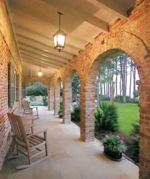 New loggias add character to the house and provide a sheltered porch from which to enjoy the ocean view. Spencer left in place an existing row of palms that filter the view in both directions between the house and the beach and that cast long, lovely shadows on the lawn.