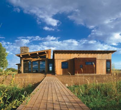 A shed roof translates into a sloping, wood-lined ceiling inside.