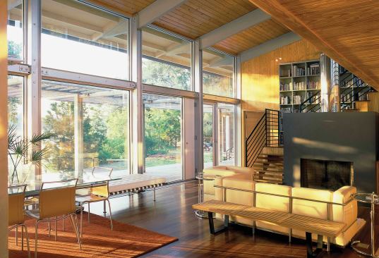 Wood floors, walls, and ceilings add warmth to the home's interiors.