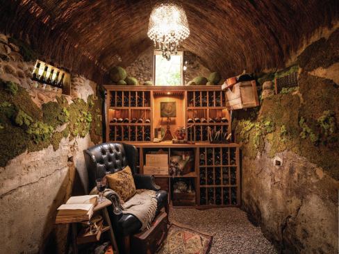 A custom-made raw walnut wine rack holds more than 180 bottles.