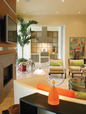 When the sliding glass panels are pushed open, indoor and outdoor spaces become one, so the outdoor kitchen had to look as good as the one indoors. Beside the kitchen is a door that opens to the courtyard, providing access to the house when the panels are closed and leading to a bathroom convenient to the pool.
