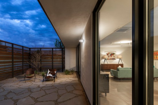 The screen along with deep overhangs shade the abundant glass on the front elevation. 