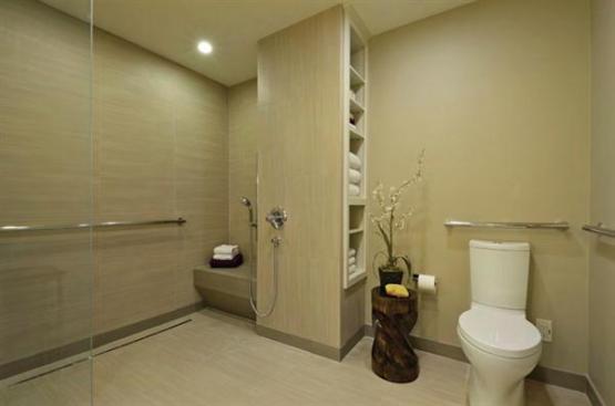 The+curbless+shower+is+made+with+slip-resistant+tile.The+ADA+toilet+is+pre-plumbed+for+bidet%2c+and+includes+grab+bars.+