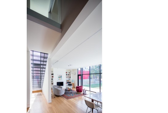 The double-height space serves as a transition between old and new.