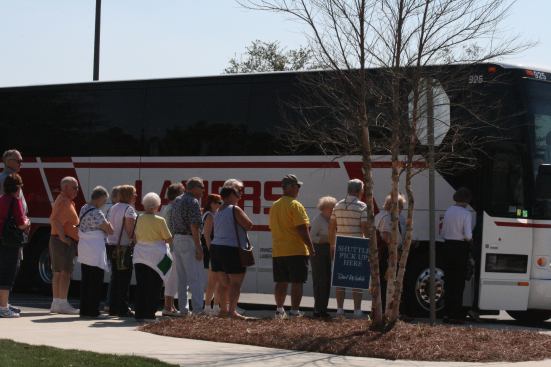 The overflow parking lots at Del Webb’s Stone Creek community near Ocala was so full that buses were used to take visitors to the grand opening of its new model park on February 19.