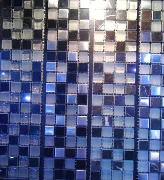 Diamond Tech Tiles  Glass mosaics are common, but these days manufacturers are mixing media. In this case, the company mixes marble, stainless steel, and glass in a&nbsp;single sheet. The product comes in 14 color combinations. 
www.dttiles.com.