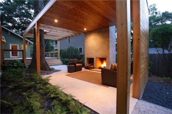 CHDA 2009 – Outdoor Spaces / Merit Award  Architect: Lightroom LLC, Decatur, Ga.; Builder: Pinnacle Custom Builders, Decatur   Local materials and references to Southern vernacular building types inform the sculptural modernism of this cost-efficient backyard complex. The living pavilion's freestanding fireplace makes reference to the chimneys of burned-out country houses that dot the Georgia countryside. Nature intervenes in the form of a stately water oak that anchors a corner of the living area, rising through a roof that dissolves into an open trellis.