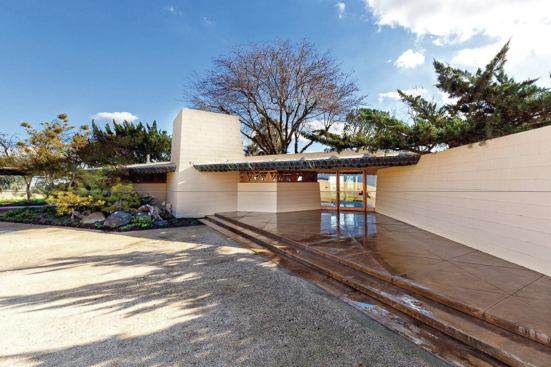 Pink-painted concrete walls were returned to their original sand color, and the concrete forecourt was refurbished.