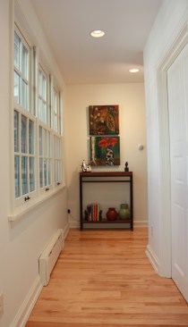 This farmhouse had received several updates and renova-
tions over the years. However, the floor plan was conflict-
ing amongst the kitchen, laundry, mudroom, and powder 
room. A complete reorganization of the first floor was 
achieved through multiple structural changes that al-
lowed for a larger kitchen and created better flow be-
tween adjacent rooms. The kitchen includes custom 
painted cabinetry, a farmhouse style sink, and soapstone 
countertops. A commercial size Viking range, hood, and 
Sub Zero refrigerator bring a theme of stainless steel to 
the kitchen which is accentuated by brushed nickel hard-
ware and island faucet. Specialty lighting, glass door 
cabinets, and a grand, eight foot island are just a few of 
the features that make this kitchen stunning.
